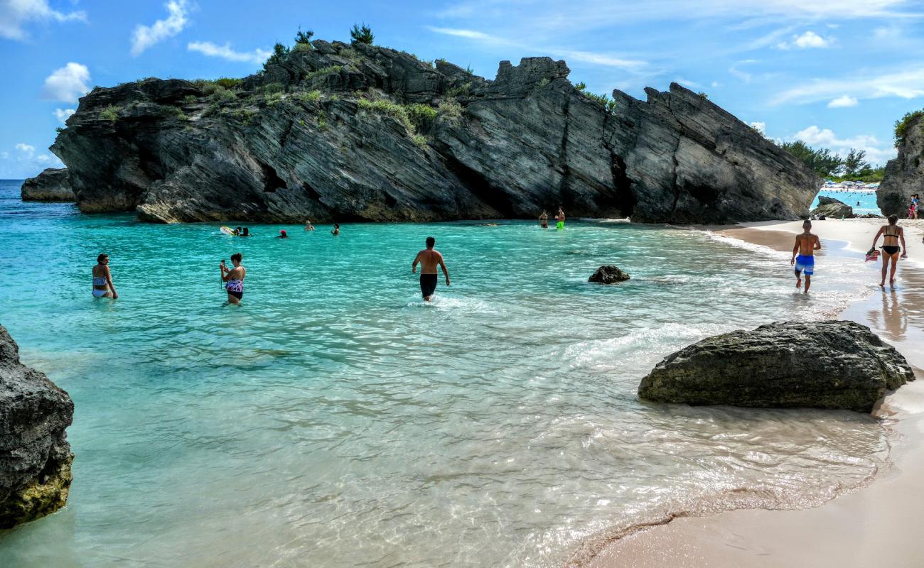 Photo of Butts Beach with bright fine sand surface