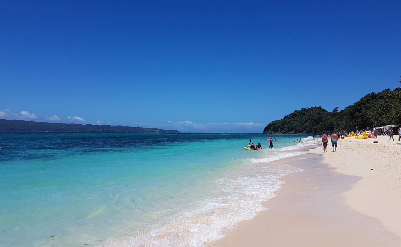 Photo of Puka Shell Beach with bright fine sand surface