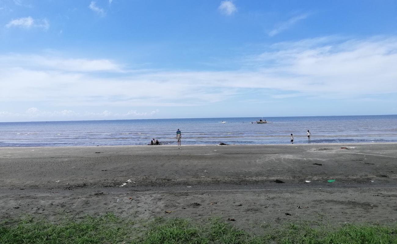 Photo of San Enrique Bay Beach with gray sand surface