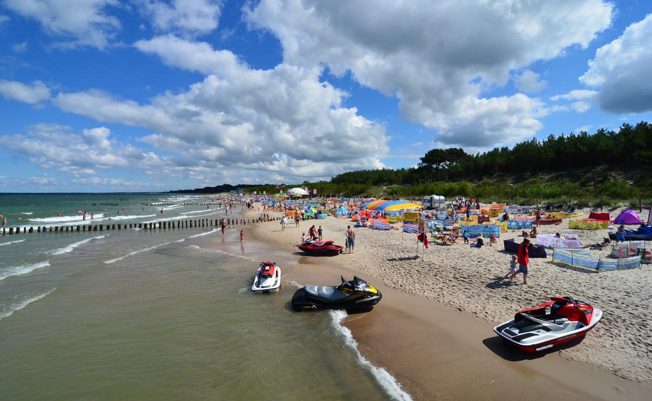 Photo of Bez barier Beach with bright fine sand surface