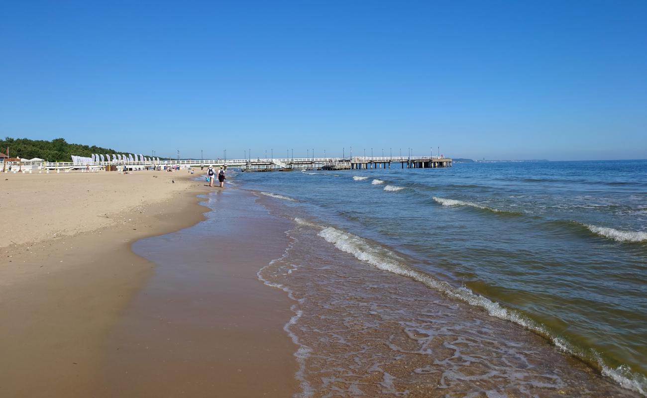 Photo of Brzezno Pier Beach with bright fine sand surface