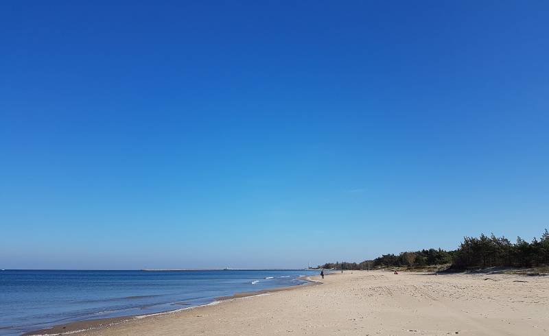 Photo of Stogi Nudist Beach with bright fine sand surface