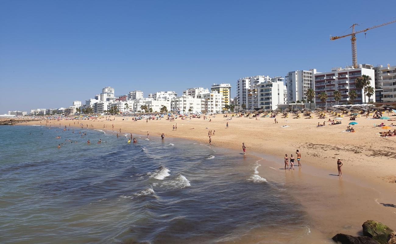 Photo of Praia de Quarteira with brown sand surface