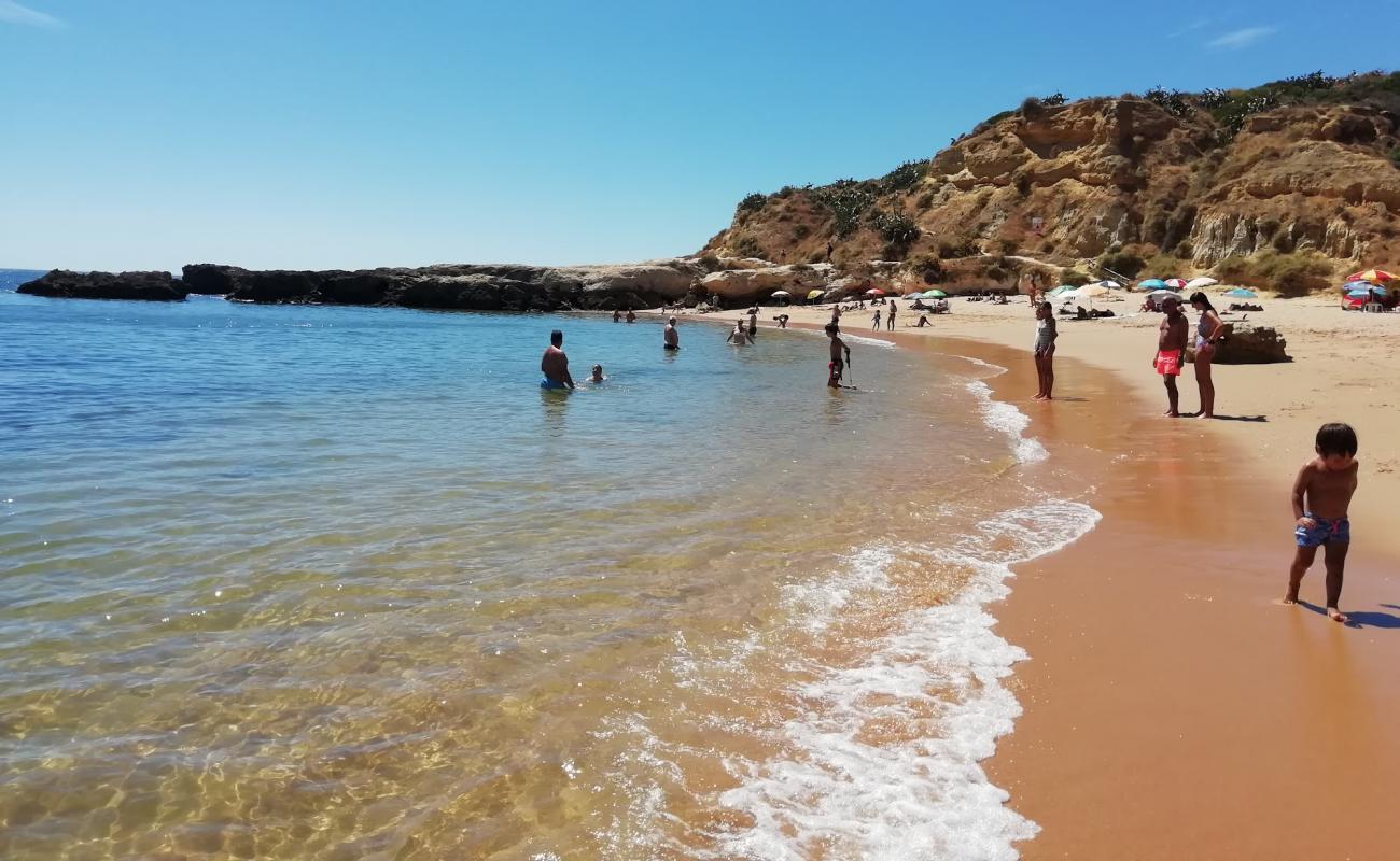 Photo of Praia dos Aveiros with brown fine sand surface