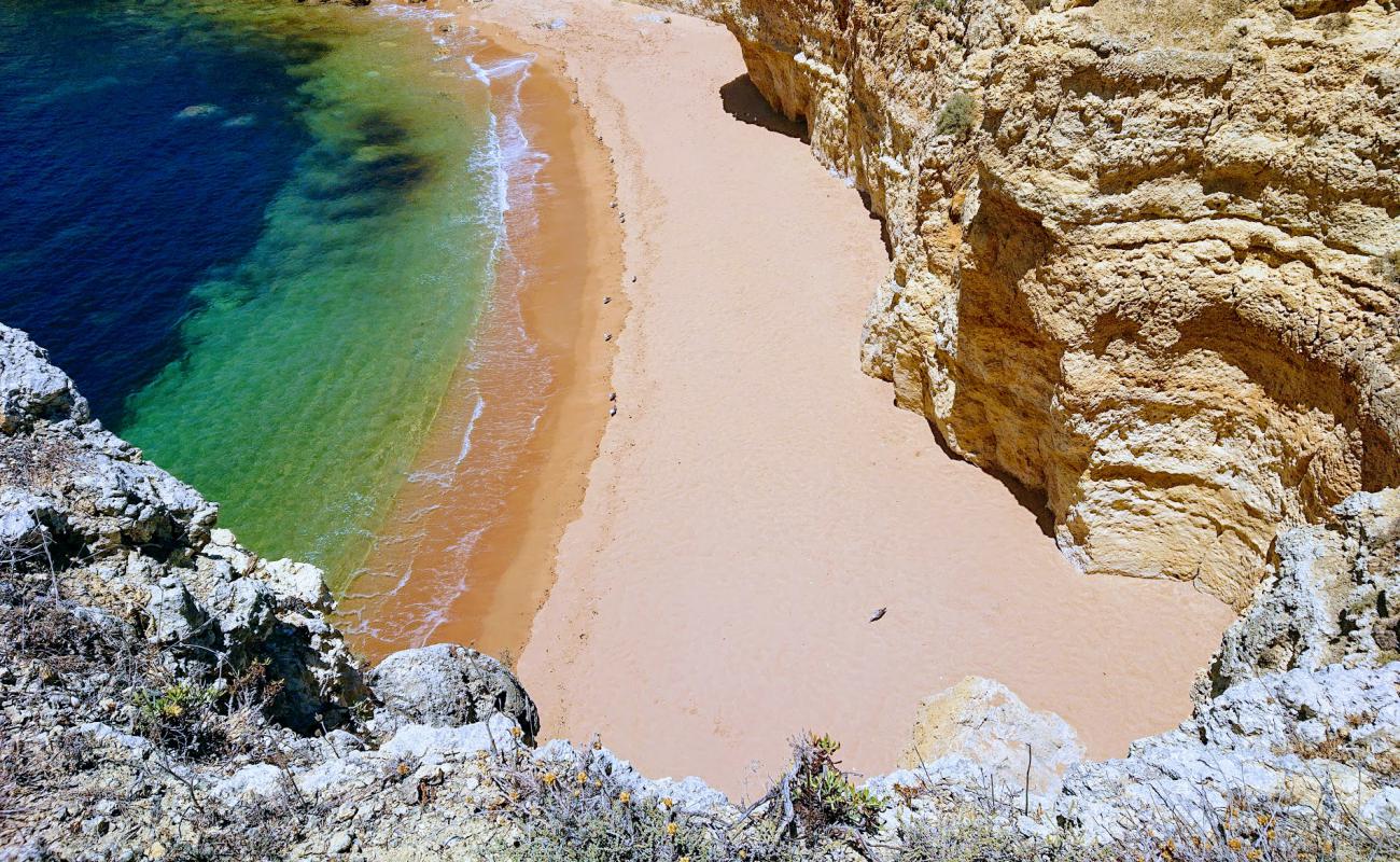 Photo of Praia da Ponta Grande with bright fine sand surface