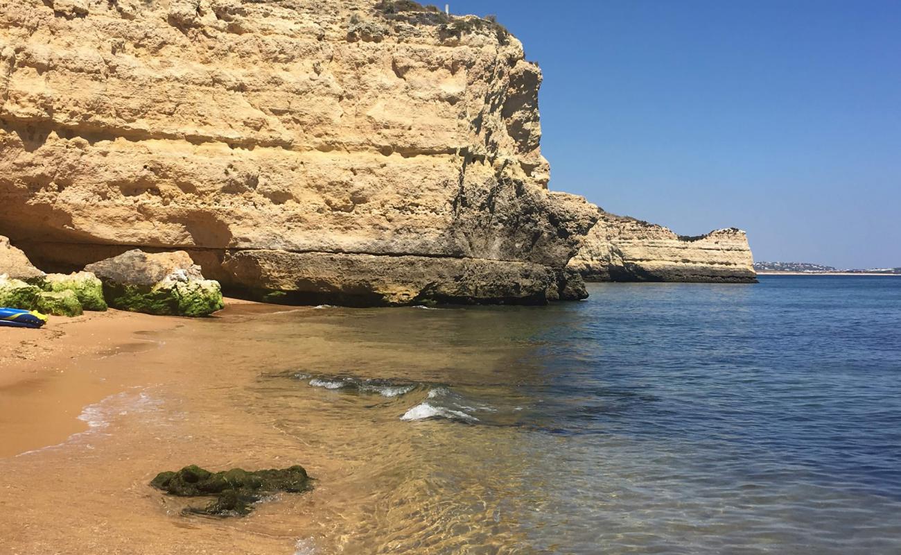 Photo of Praia dos Cavalos with brown sand surface