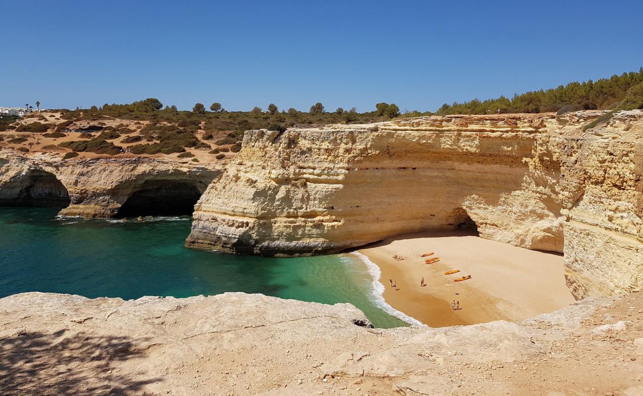 Photo of Praia da Corredoura with brown fine sand surface