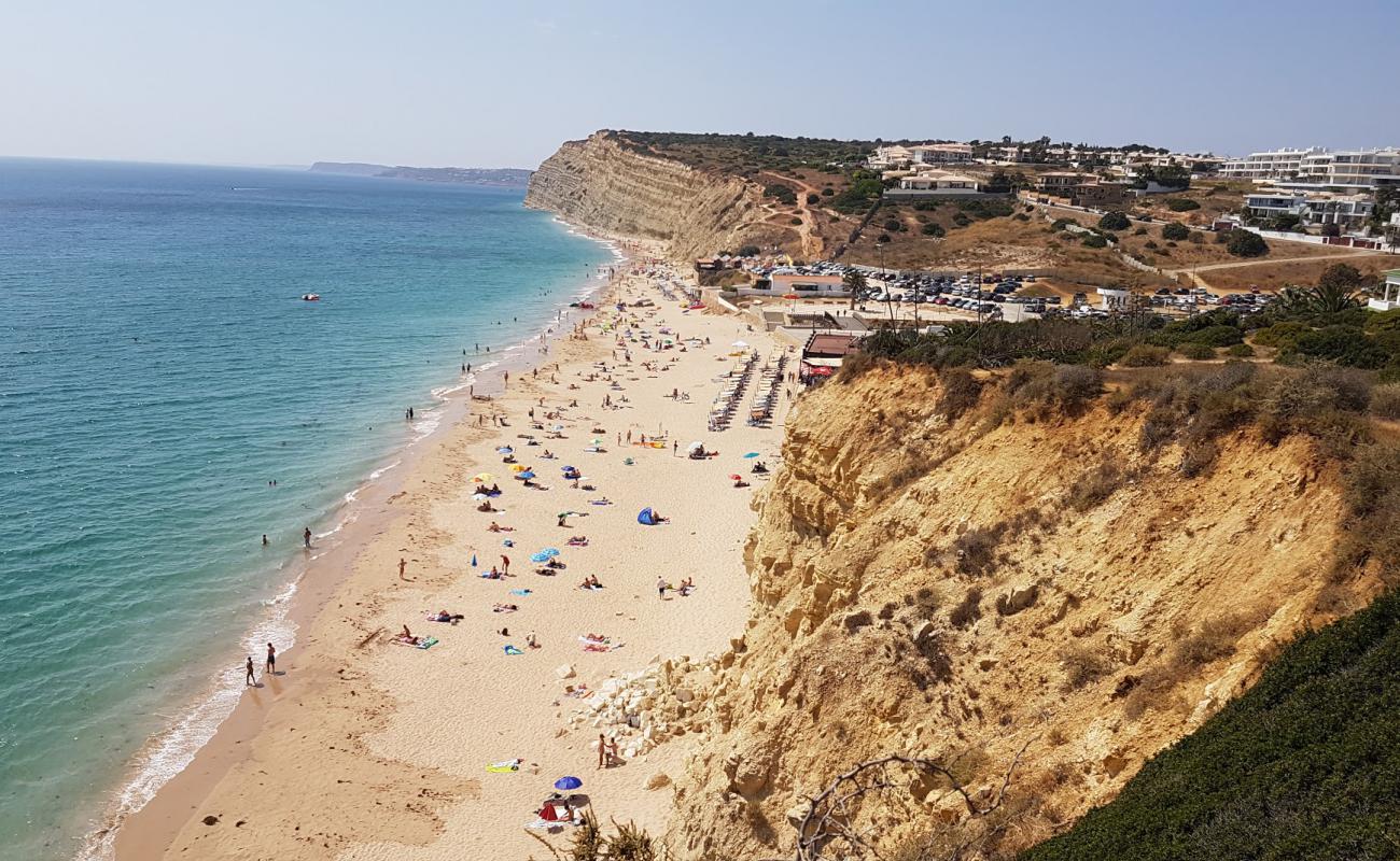 Photo of Praia de Porto de Mos with bright fine sand surface