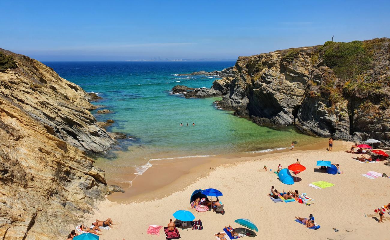 Photo of Praia do Serro da Aguia with bright sand surface