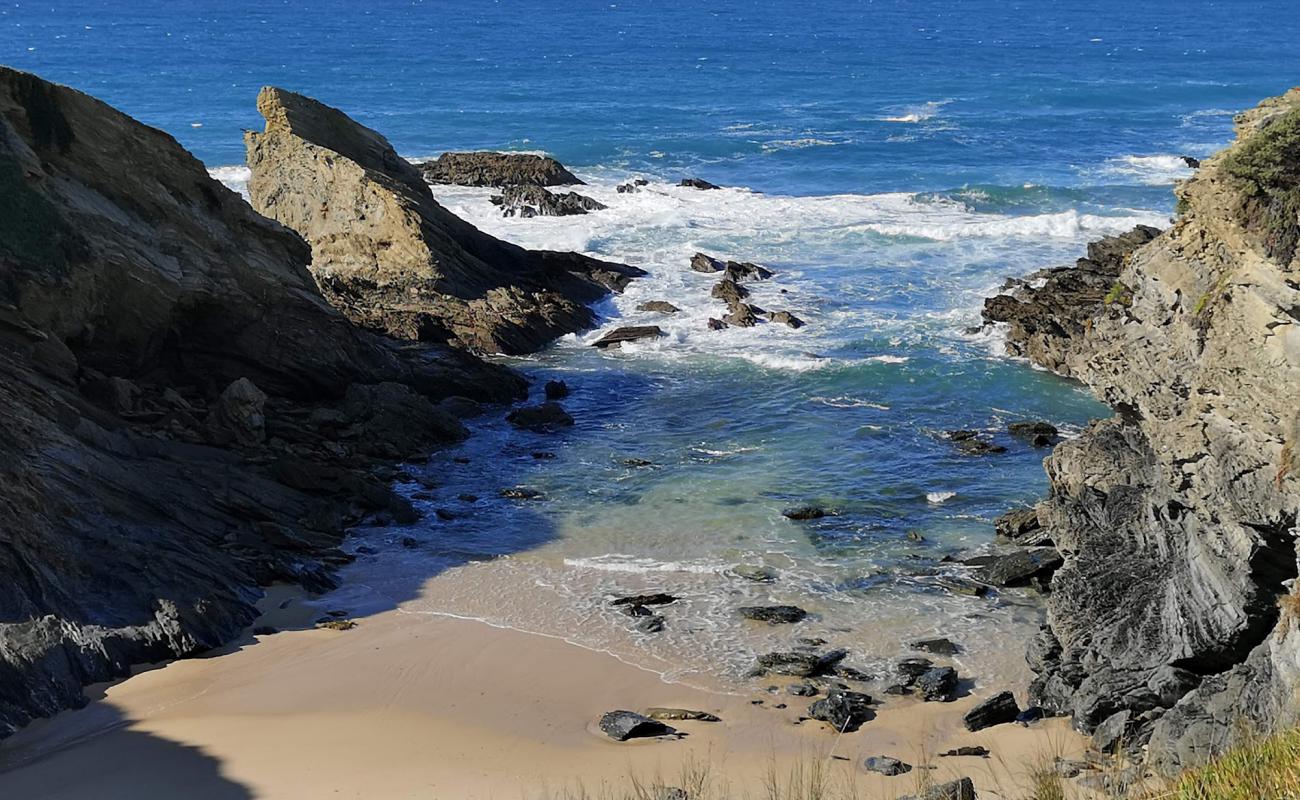 Photo of Praia de Porto Covinho with bright fine sand surface