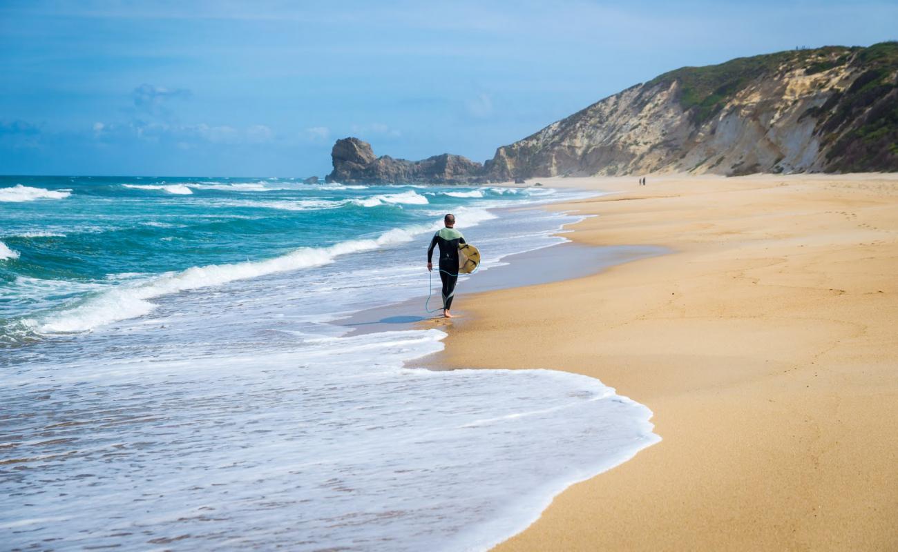 Photo of Praia da Mina with bright sand surface