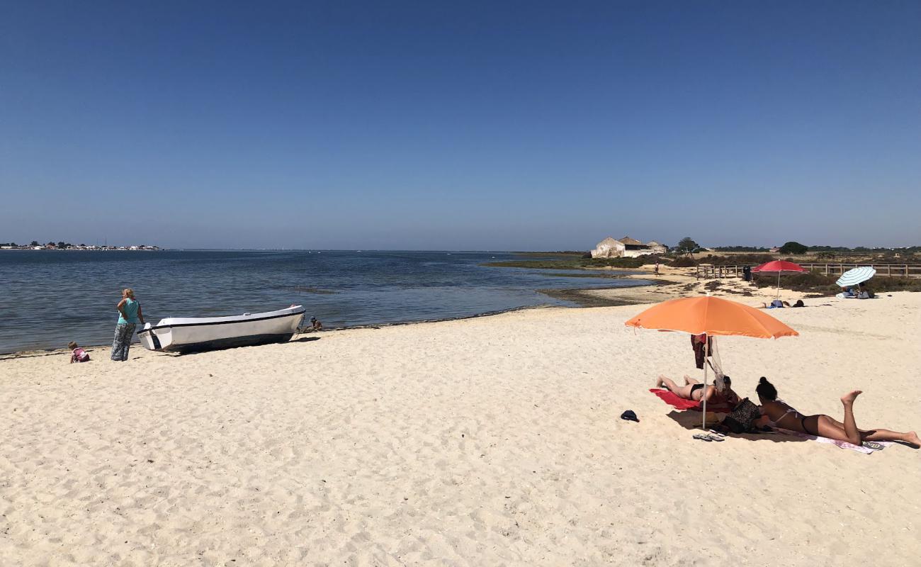 Photo of Praia dos Cavacos with bright sand surface