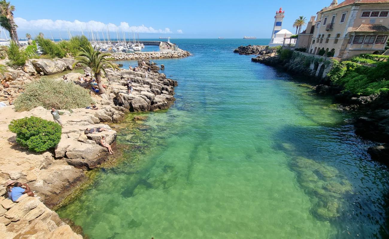 Photo of Praia de Santa Marta with bright sand surface