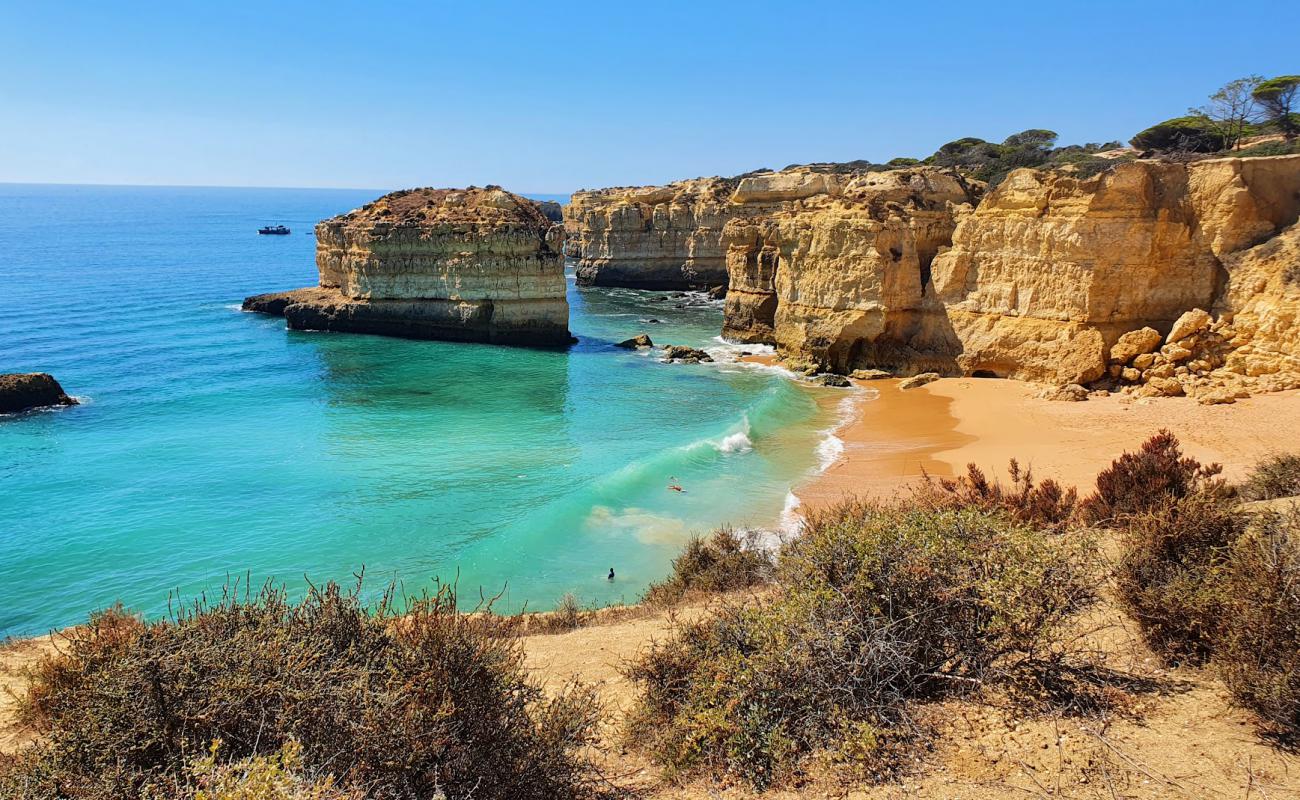 Photo of Praia das Salamitras with bright sand surface