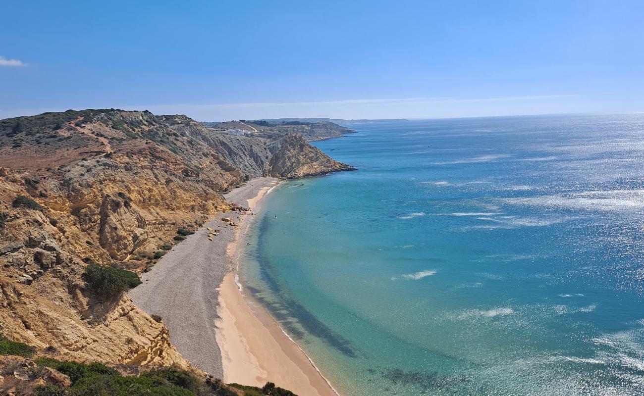 Photo of Praia dos Rebolos with gray pebble surface