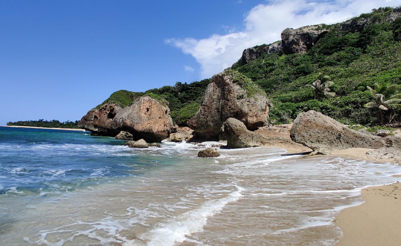 Photo of Punta Borinquen II beach with gray sand &  rocks surface