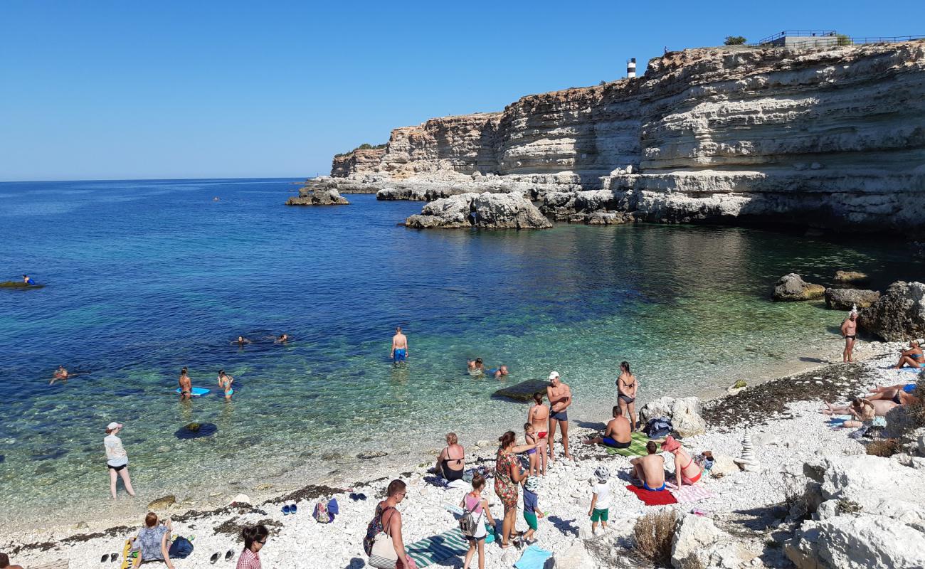 Photo of Blue Bay beach with white pebble surface