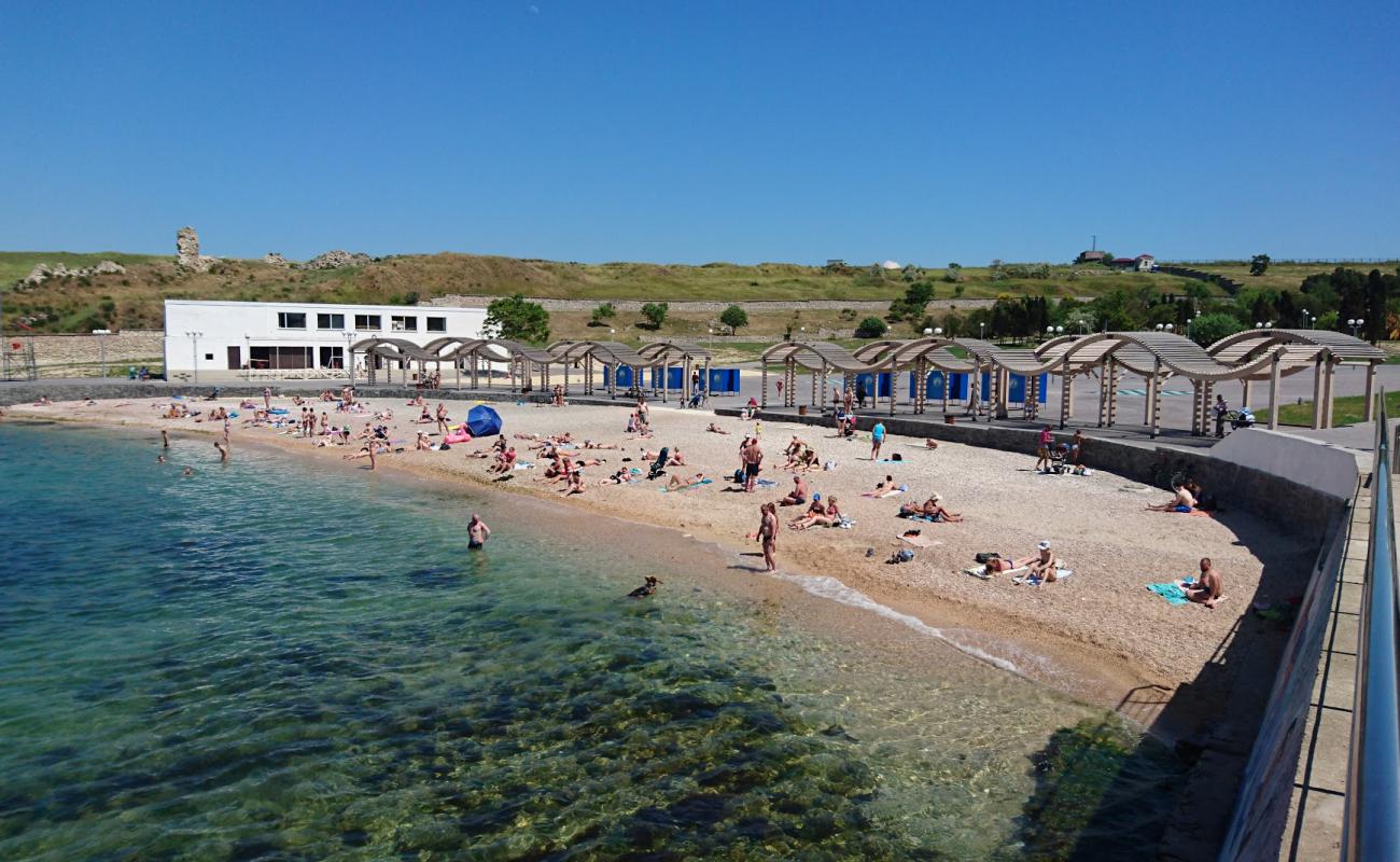 Photo of Sunny beach with light pebble surface