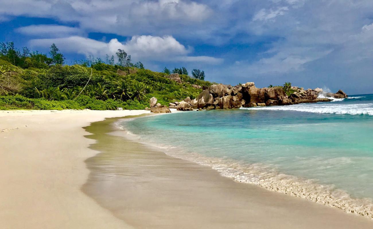 Photo of Anse Cocos Beach with white fine sand surface