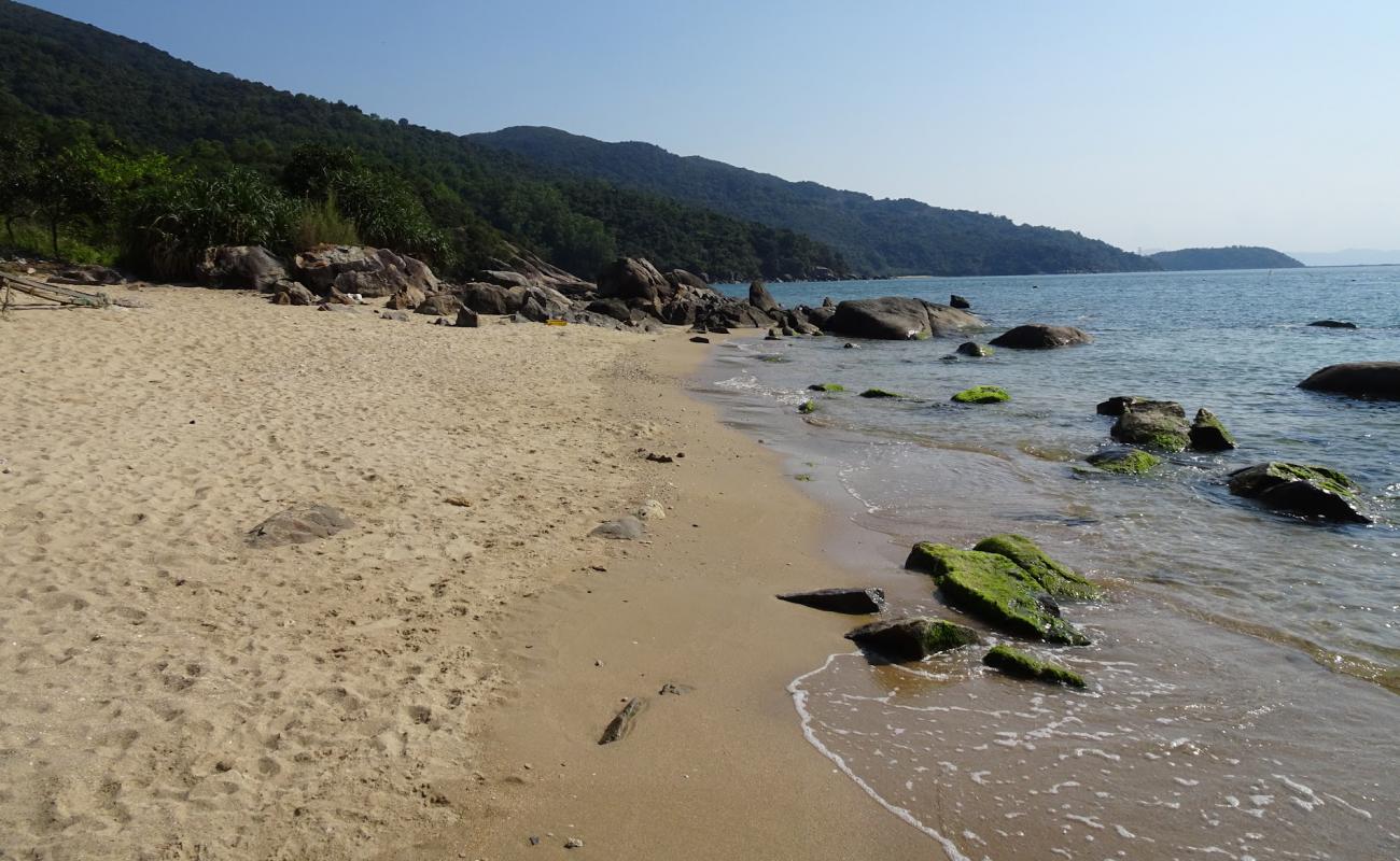 Photo of Group Beach with bright sand & rocks surface