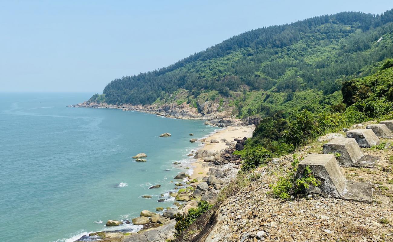 Photo of Hang Lang Co Vi Beach with bright sand & rocks surface