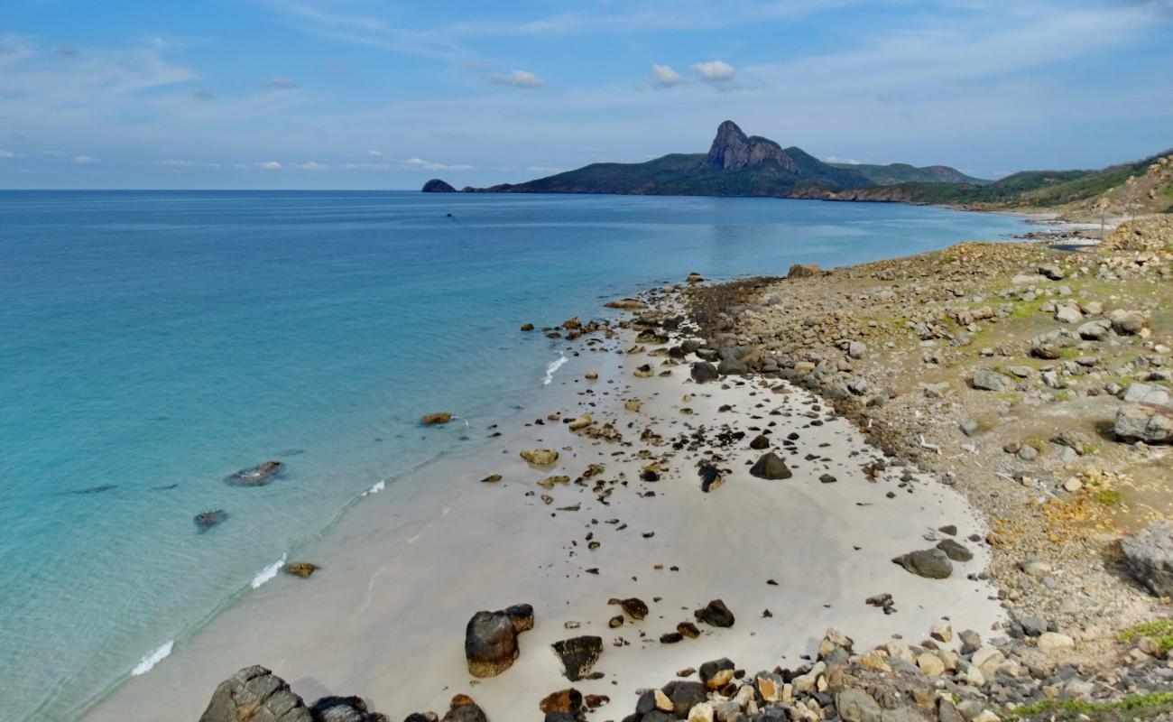 Photo of Shy Beach with bright sand & rocks surface