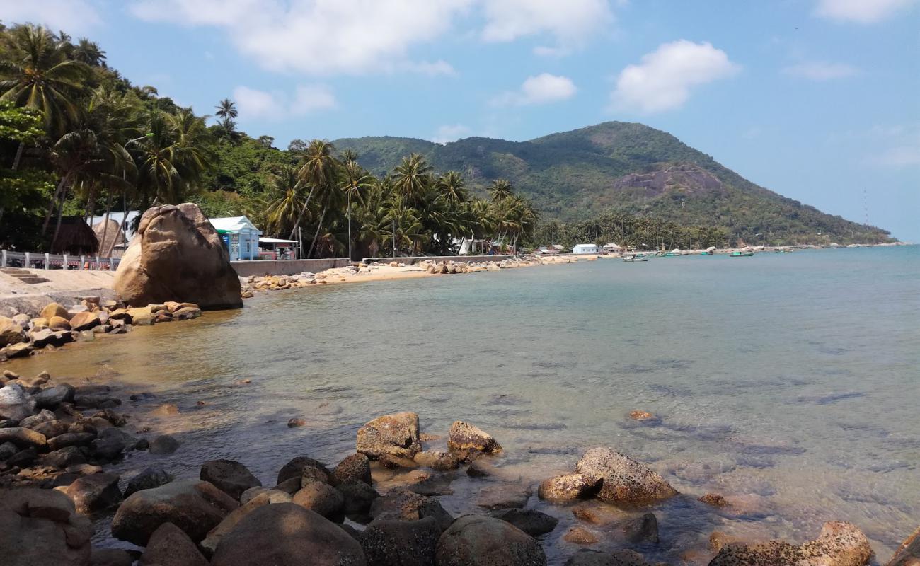 Photo of BaiBo Beach with bright sand & rocks surface