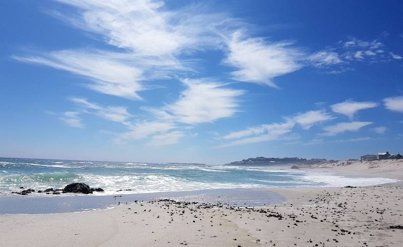 Photo of Yzerfontein beach with bright sand surface