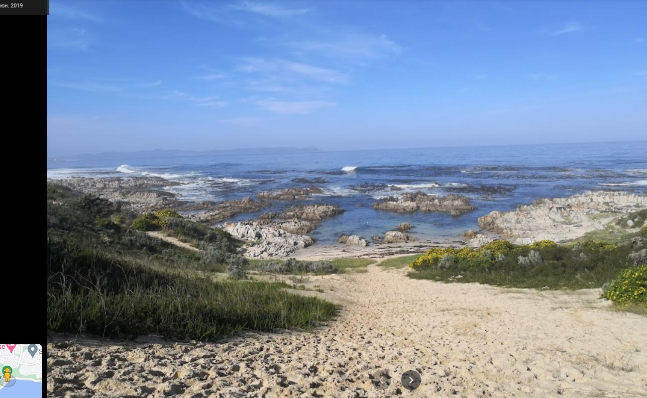 Photo of Breakfast Bay beach with bright sand & rocks surface