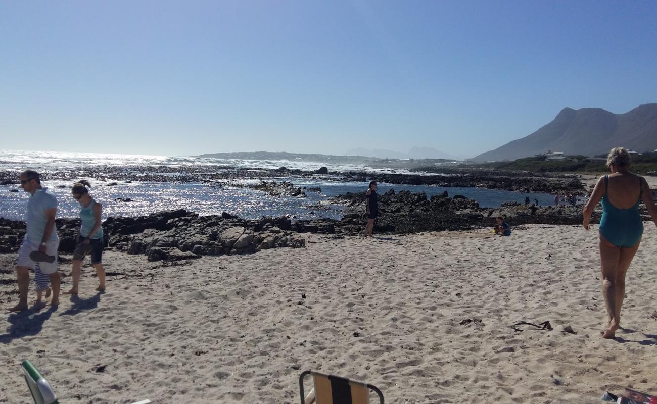 Photo of Sandbaai beach with bright sand & rocks surface