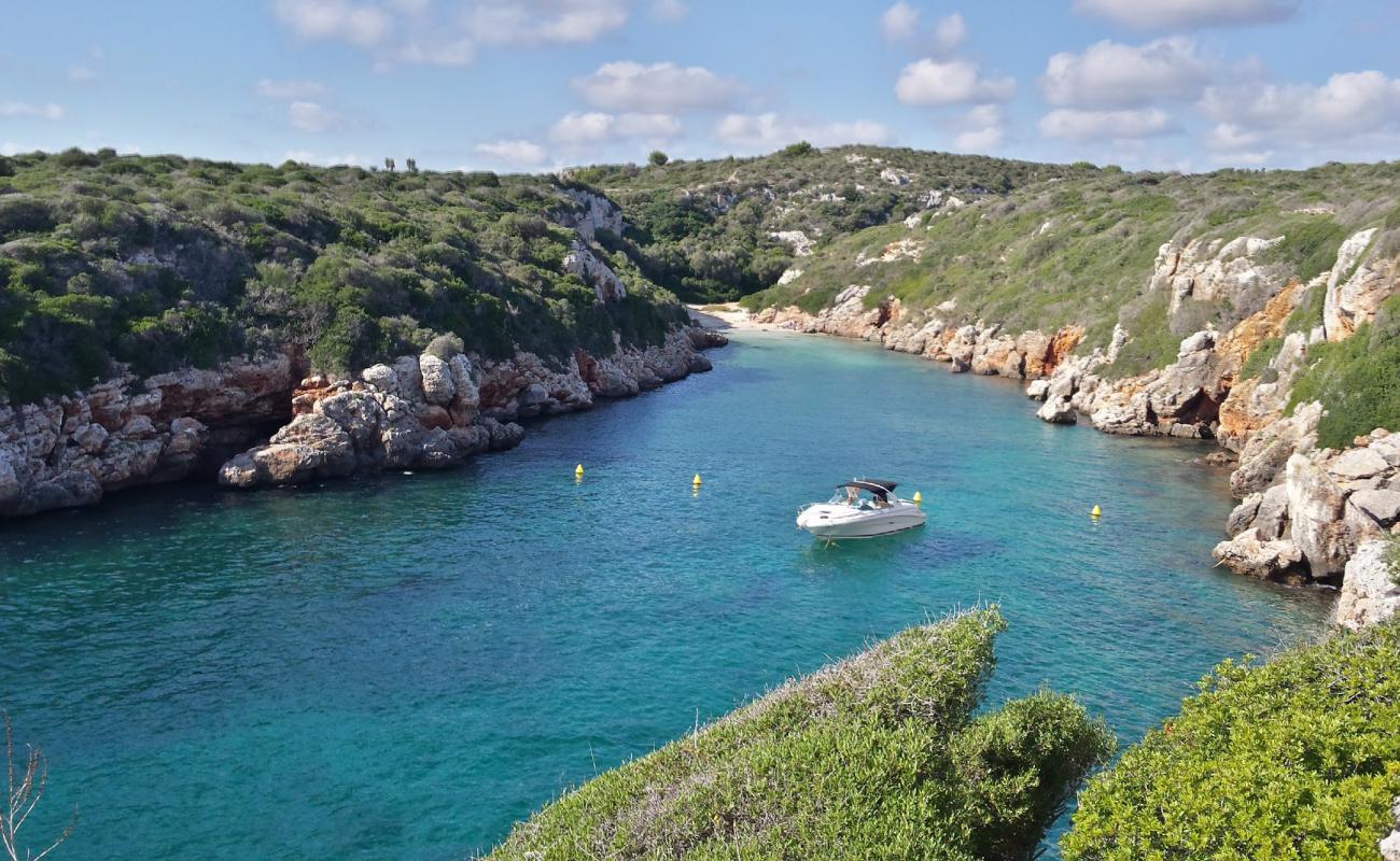 Photo of Cala de Biniparratx with rocks cover surface