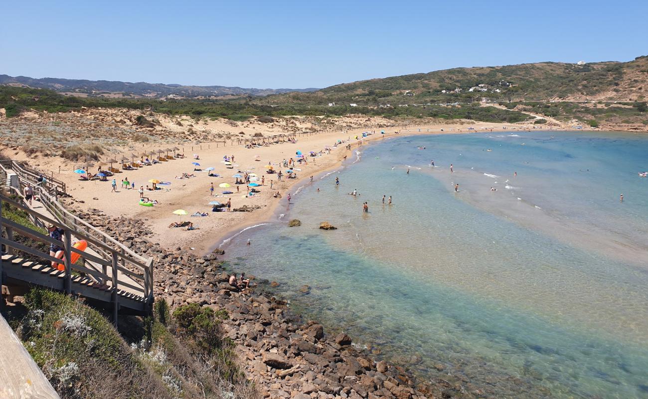 Photo of Fornells Beach with brown sand surface