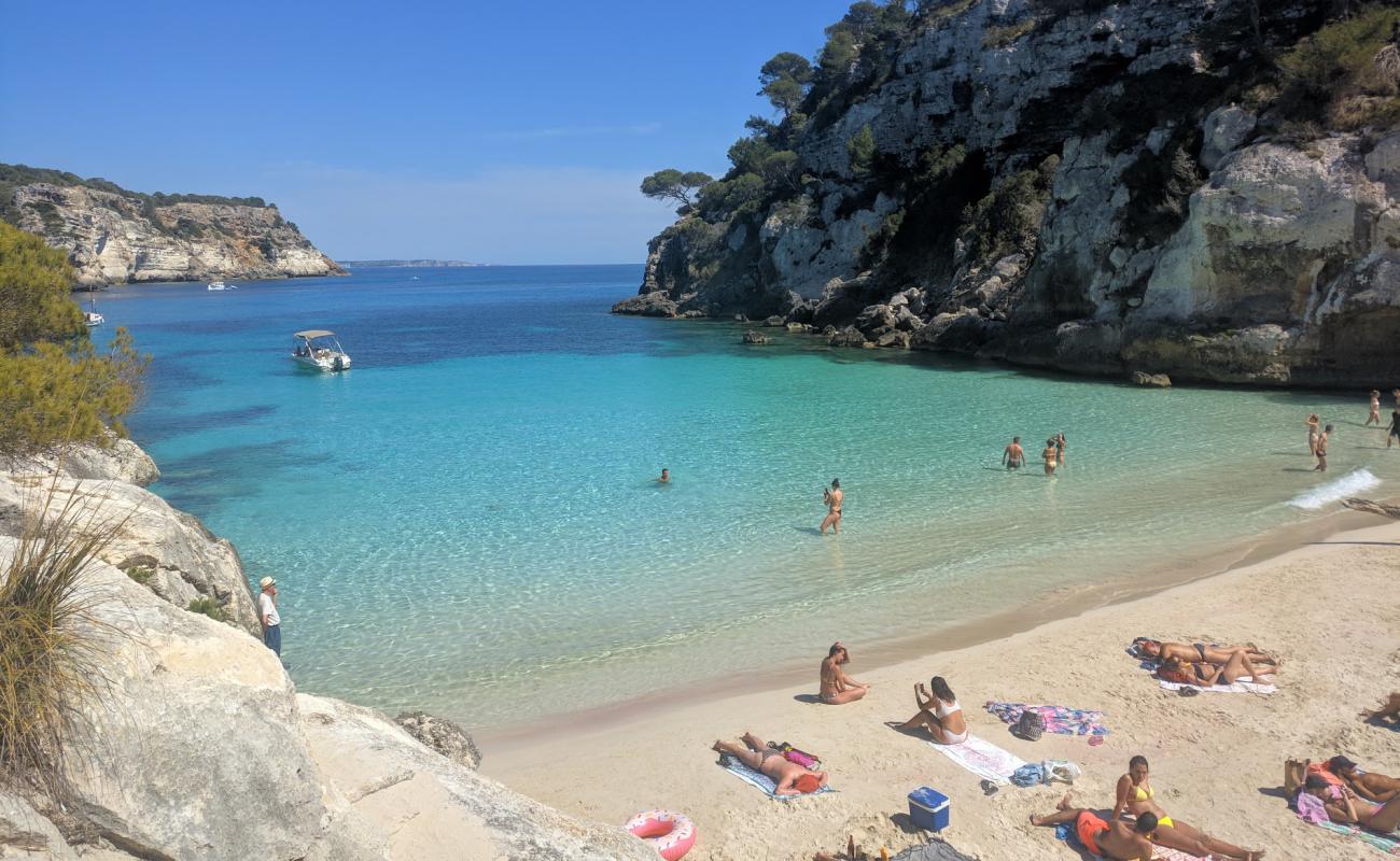 Photo of Cala Macarelleta beach with bright fine sand surface