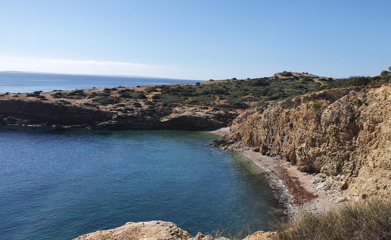 Photo of Cala Tranquila with gray sand &  rocks surface