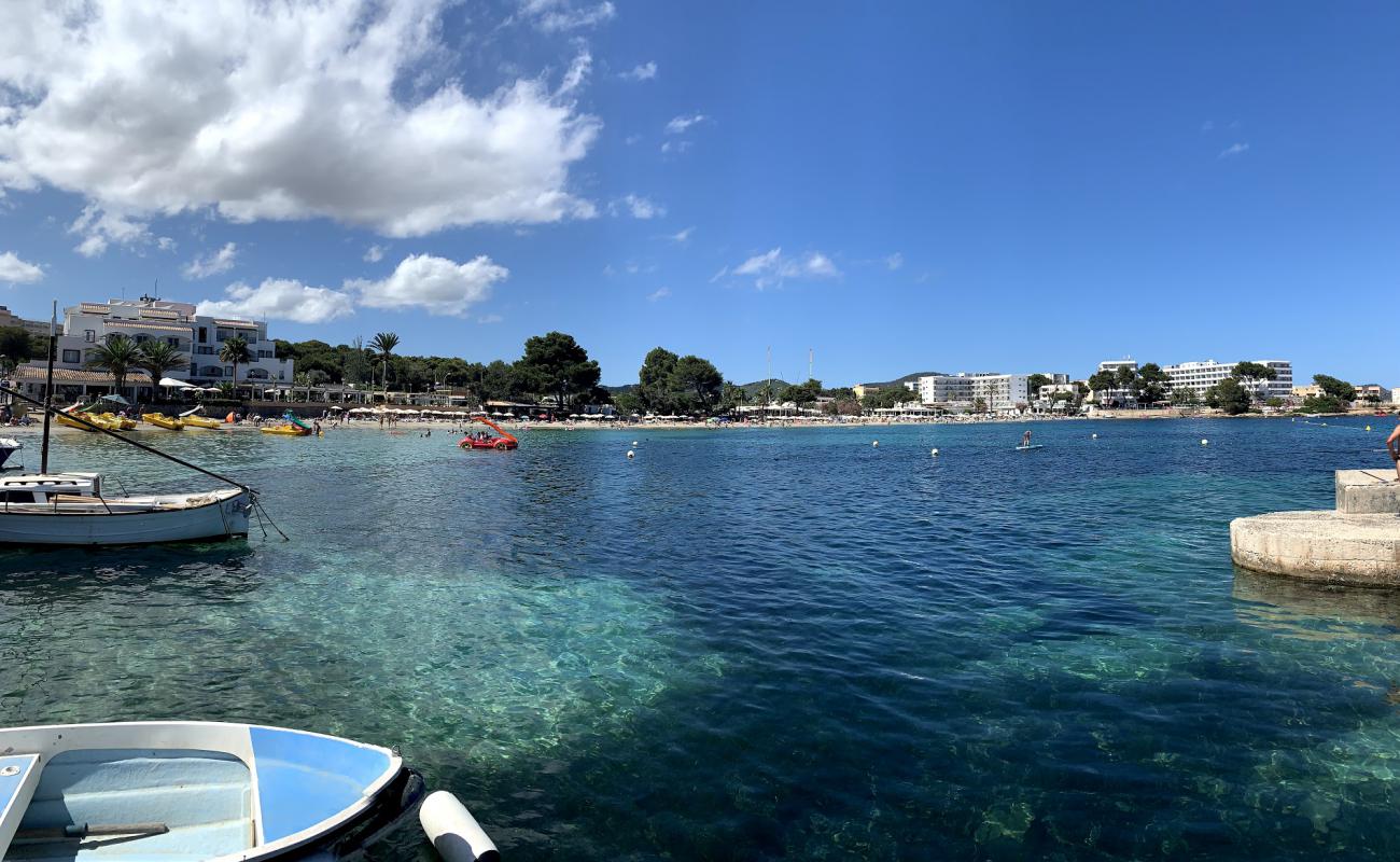 Photo of Es Canar Beach with bright fine sand surface