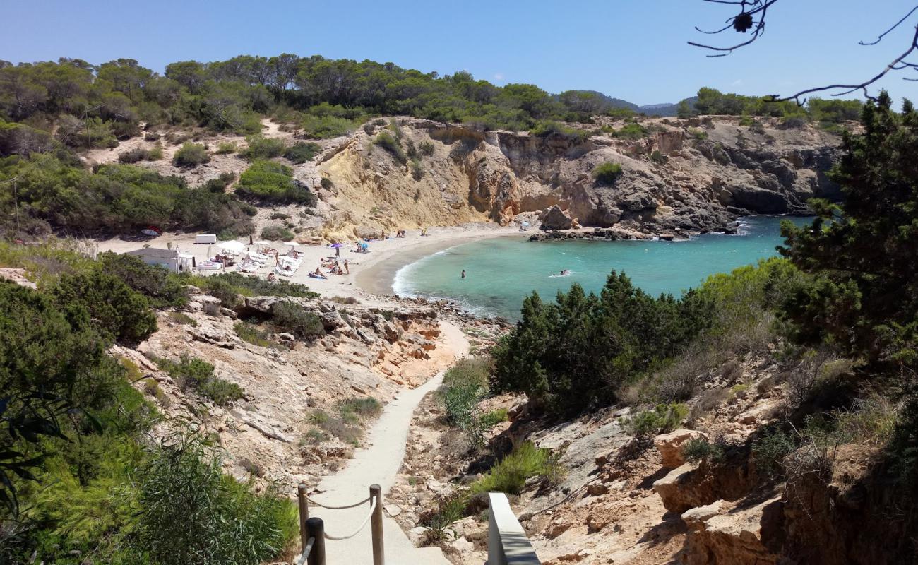 Photo of Cala Codolar with brown sand &  rocks surface