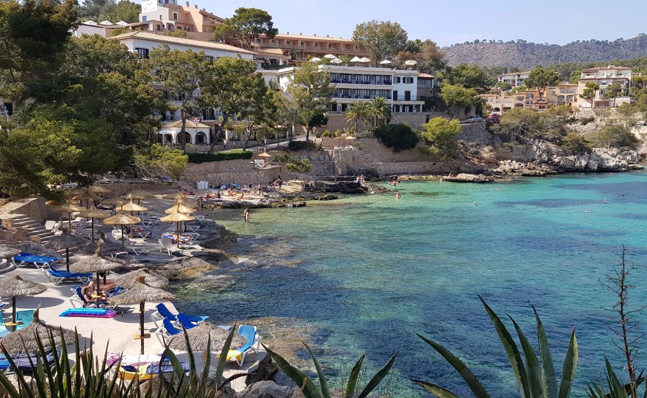 Photo of Cala fornells with bright fine sand surface