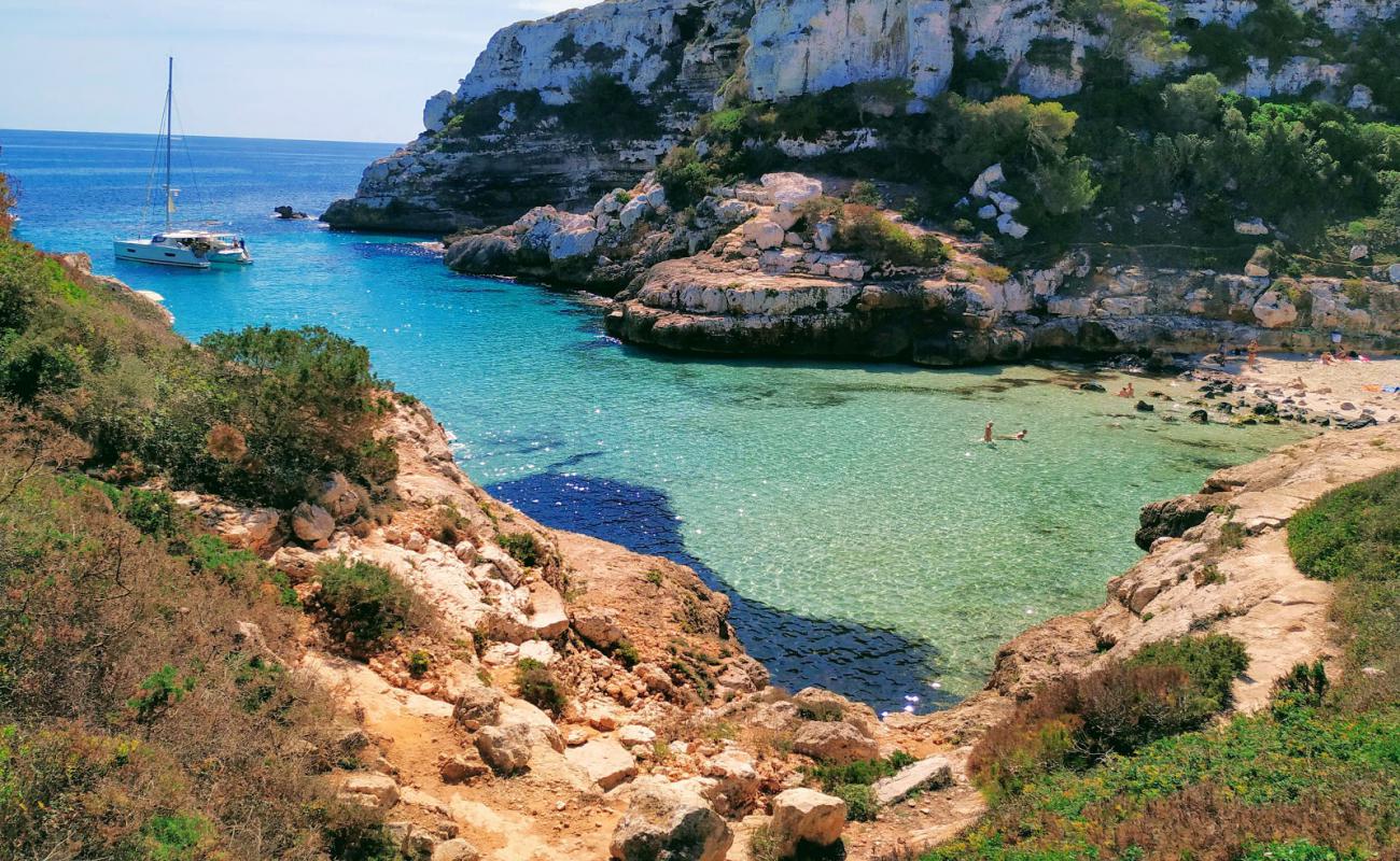 Photo of Cala Marmols with bright fine sand surface