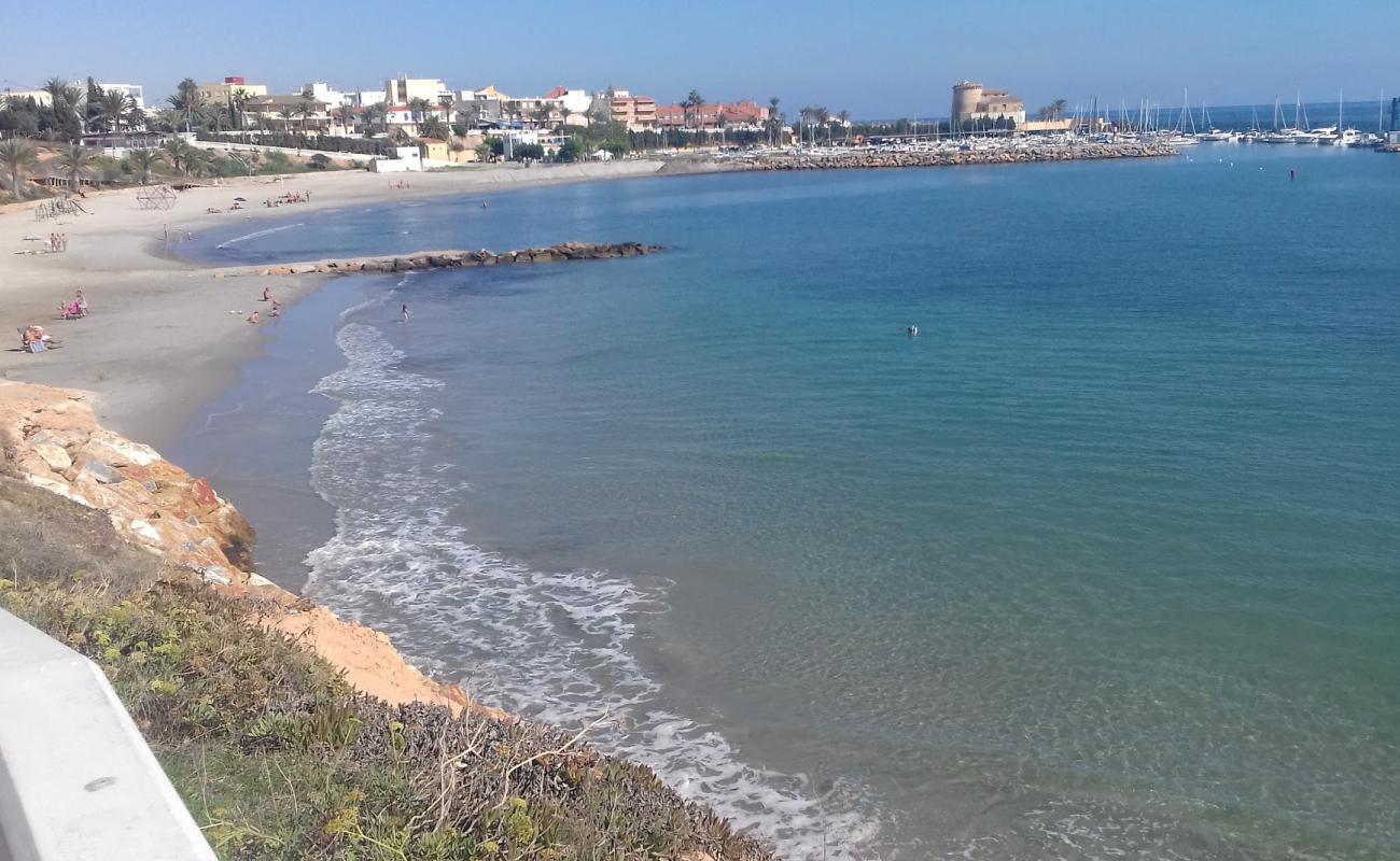 Photo of Playa del Puerto with bright sand surface