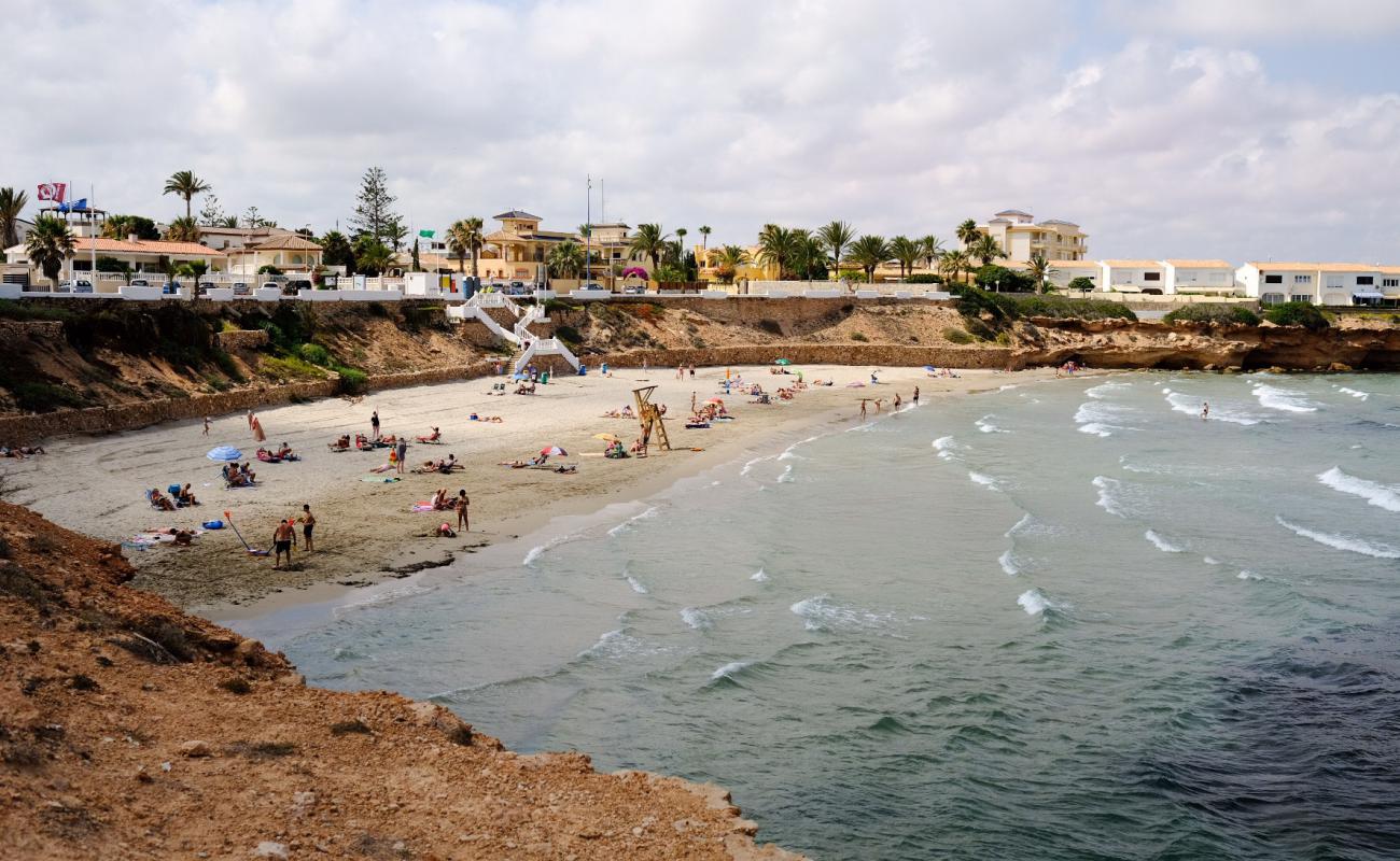 Photo of Playa Cala Cerrada with brown sand surface