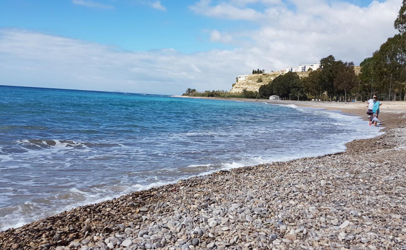 Photo of Torres Beach with black sand & pebble surface