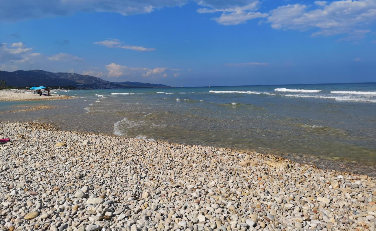 Photo of Platja del Serradal with gray pebble surface