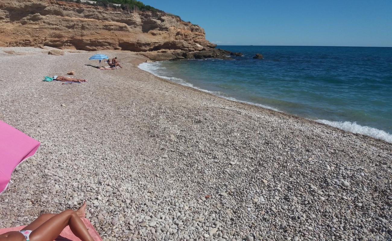 Photo of Cala del Triador with gray fine pebble surface