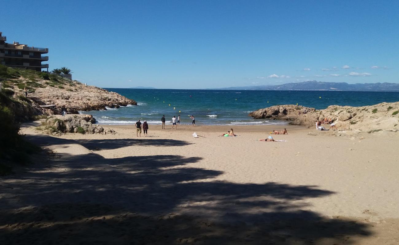 Photo of Cala Font with brown sand surface