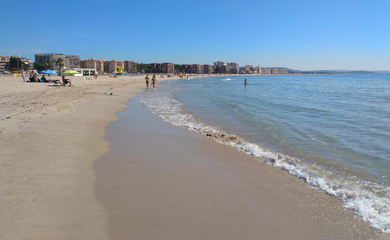 Photo of Platja de La Paella with bright sand surface