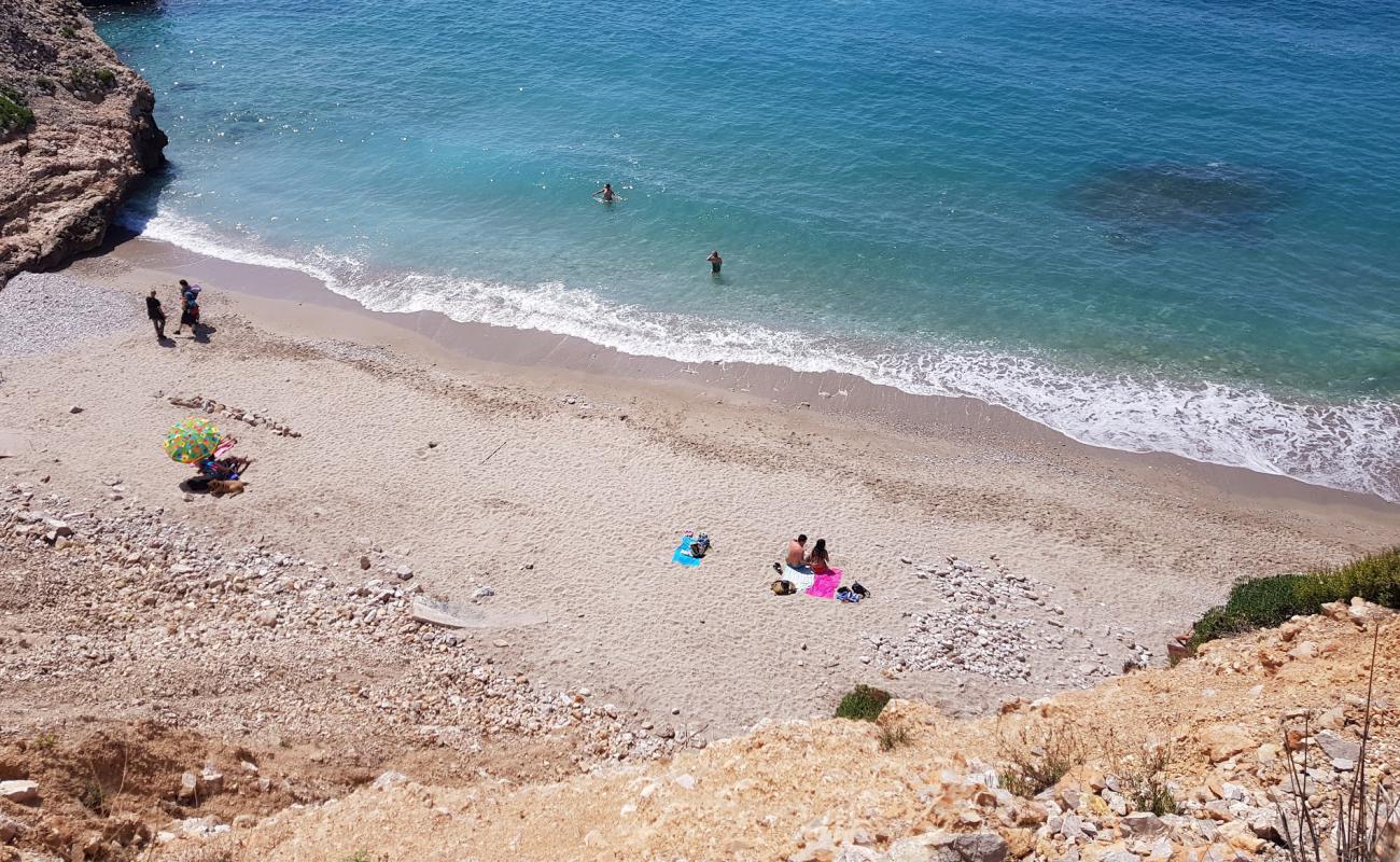 Photo of Playa de Pebre with gray sand &  rocks surface