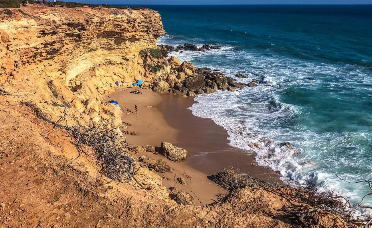 Photo of Cala del Faro with brown sand surface