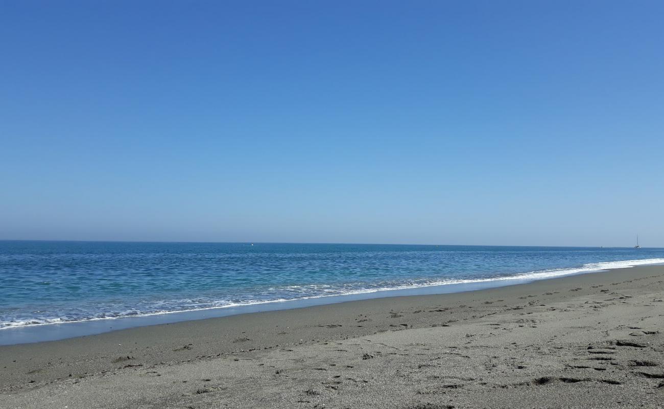 Photo of Playa los Toros with gray shell sand surface