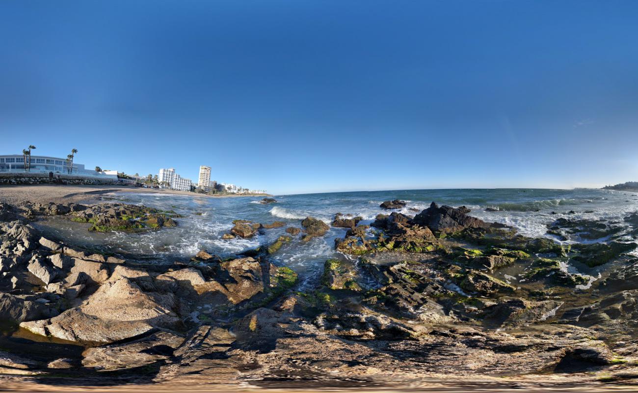 Photo of Playa Riviera with gray sand surface