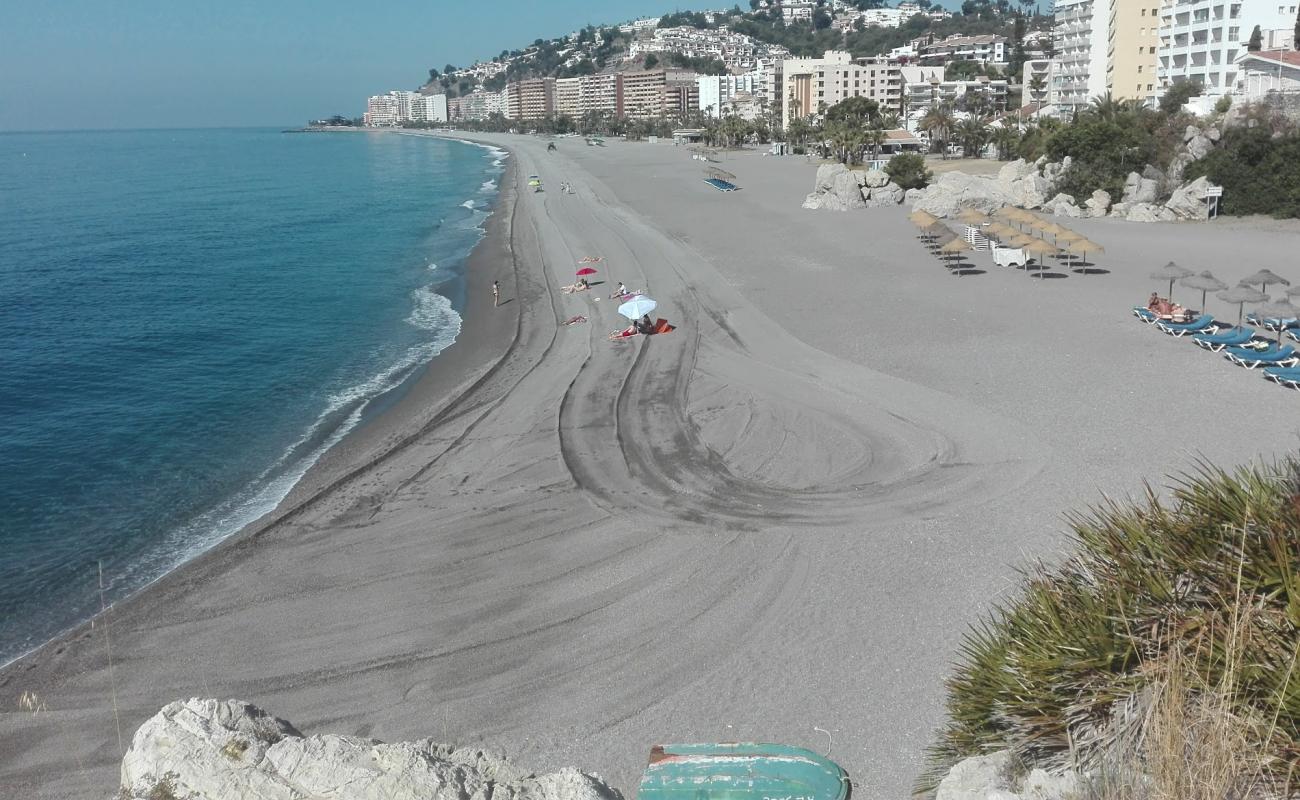 Photo of Playa de Velilla with gray fine pebble surface